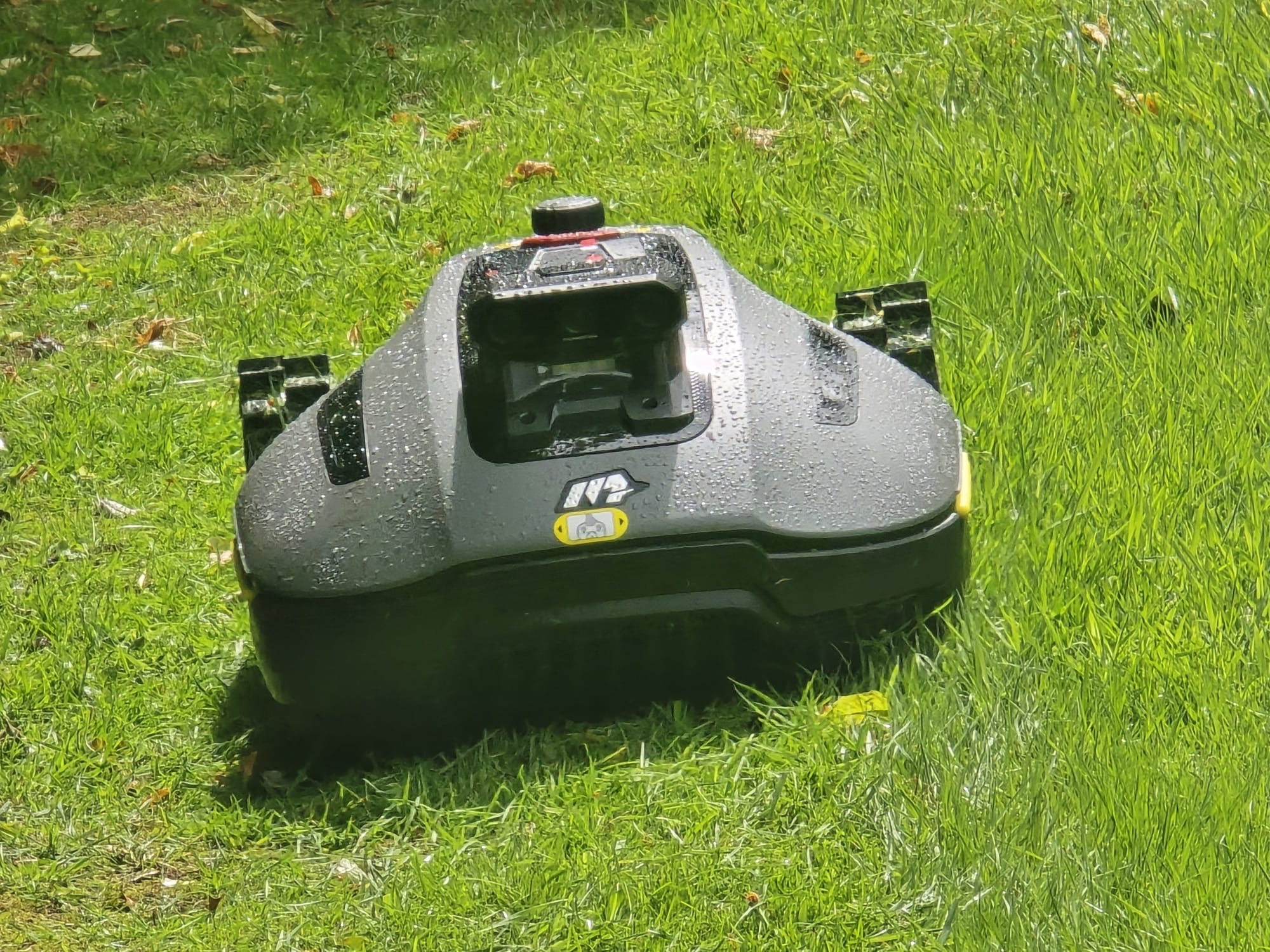 Robot mower working on a lawn, close-up detail shot