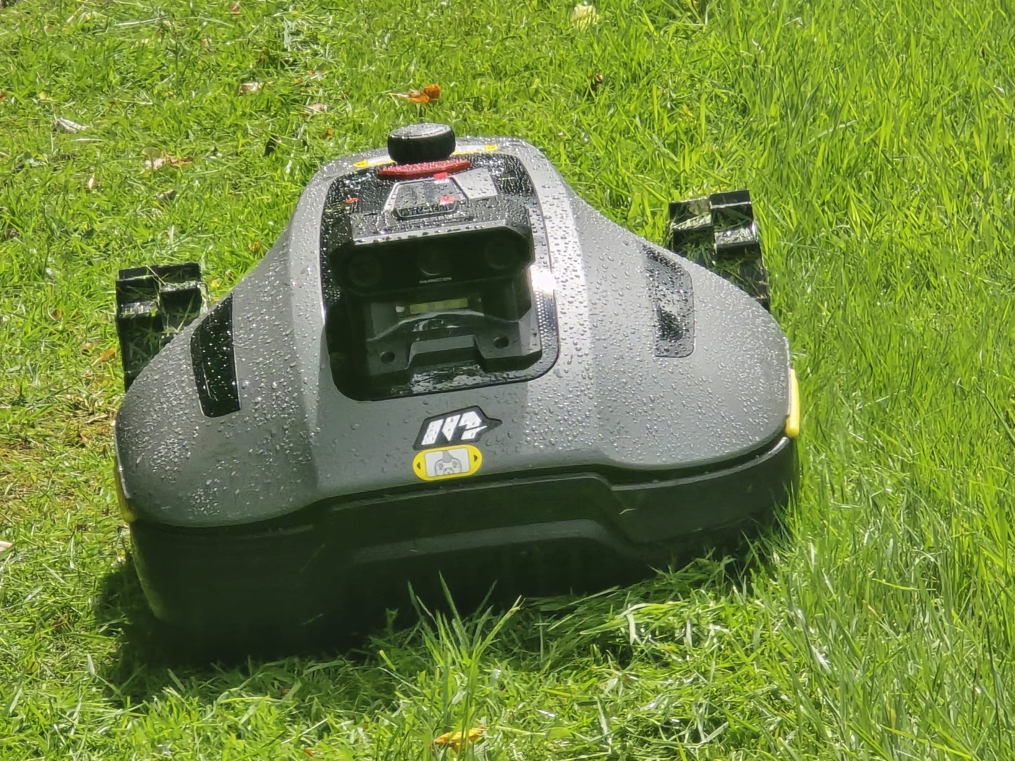 Front-on view of the robot mower working on the lawn